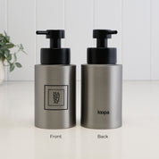 Front and back view of a 250ml brushed 304 stainless steel hand soap dispenser with black square label, Loopa branding and satin black liquid pump.