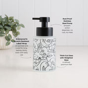 250ml frosted glass soap dispenser with black abstract face design, satin black stainless steel pump, waterproof scratch-resistant wrap and thick-cut weighted glass base, designed as a refillable hand soap or lotion dispenser.