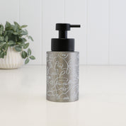 250ml brushed 304 stainless steel soap dispenser with white abstract face line art and satin black liquid pump, a compact refillable bottle for hand soap, lotion or face wash.