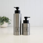 500ml dish soap and 250ml hand soap dispensers in brushed 304 stainless steel, featuring black square labels and satin black liquid pumps for a coordinated kitchen or bathroom set.