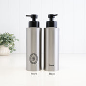 Front and back view of a 500ml brushed 304 stainless steel shampoo dispenser with black oval label, satin black liquid pump and Loopa branding, designed as a refillable bathroom or shower bottle.