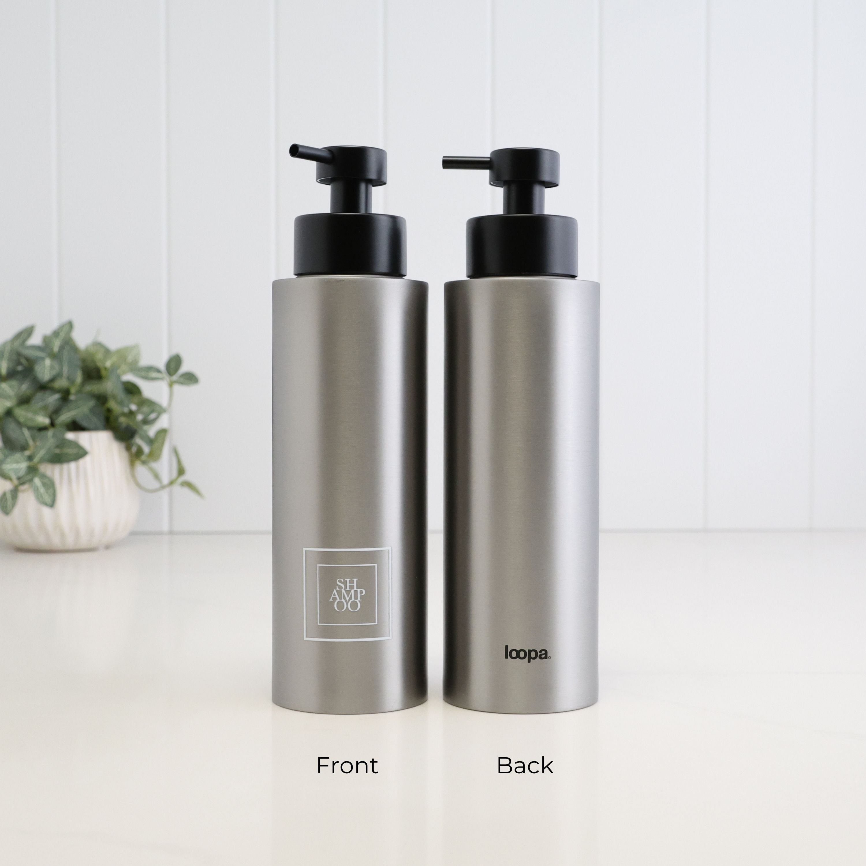 500ml brushed 304 stainless steel shampoo dispenser shown from the front and back, featuring a white square Shampoo label, Loopa branding and satin black liquid pump.