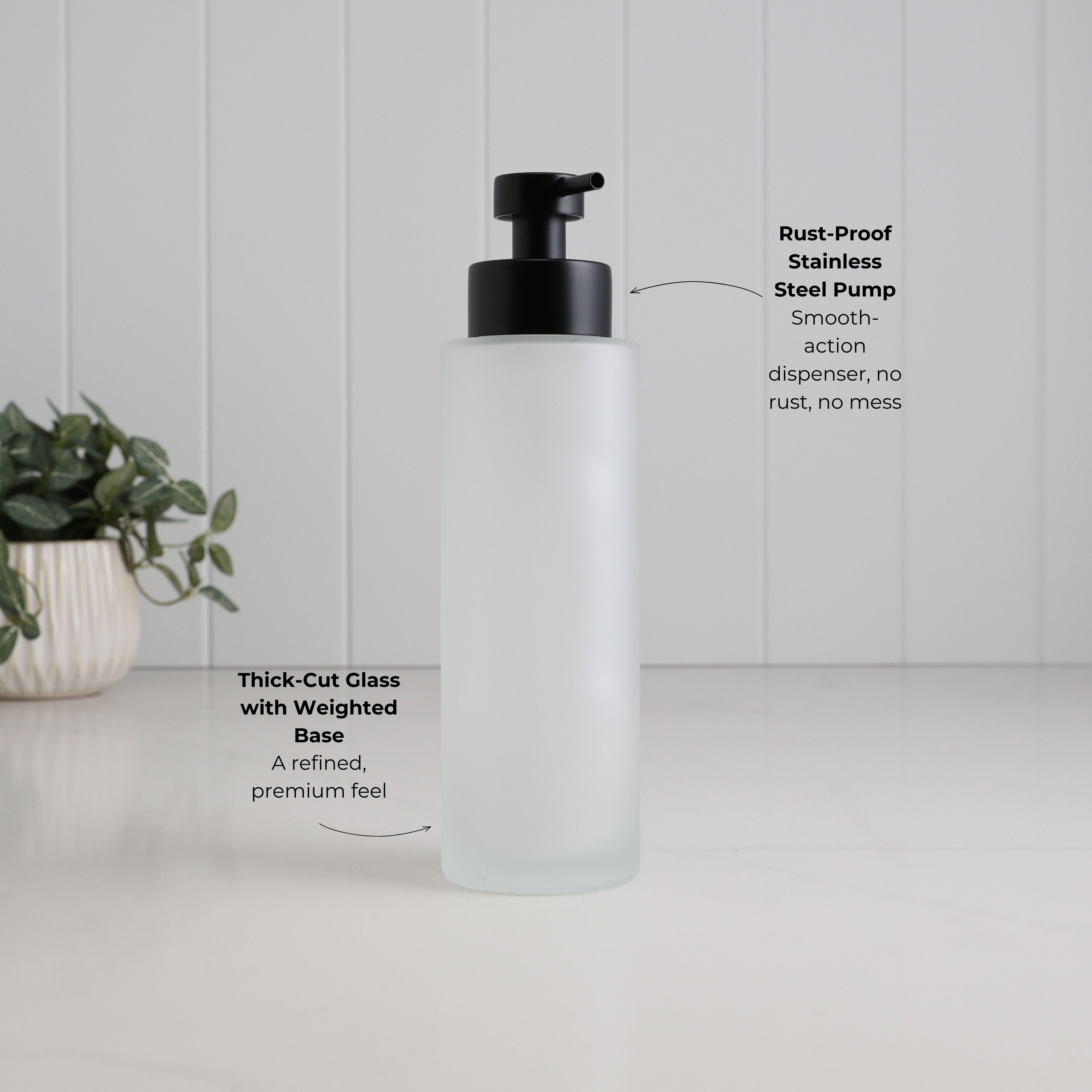 500ml frosted glass refillable soap dispenser with thick-cut weighted base and satin black stainless steel liquid pump, highlighting its premium construction and smooth-action rust-resistant dispenser.