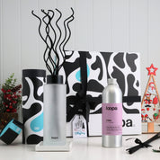 Frosted reed diffuser Christmas gift set displayed with festive décor, black swirled reeds, luxury refill bottle and premium Loopa gift box. Ideal holiday home fragrance present for her, for him or stylish seasonal gifting.