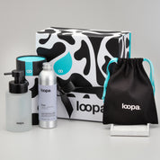 loopa product set including bottles and packaging on a gray background