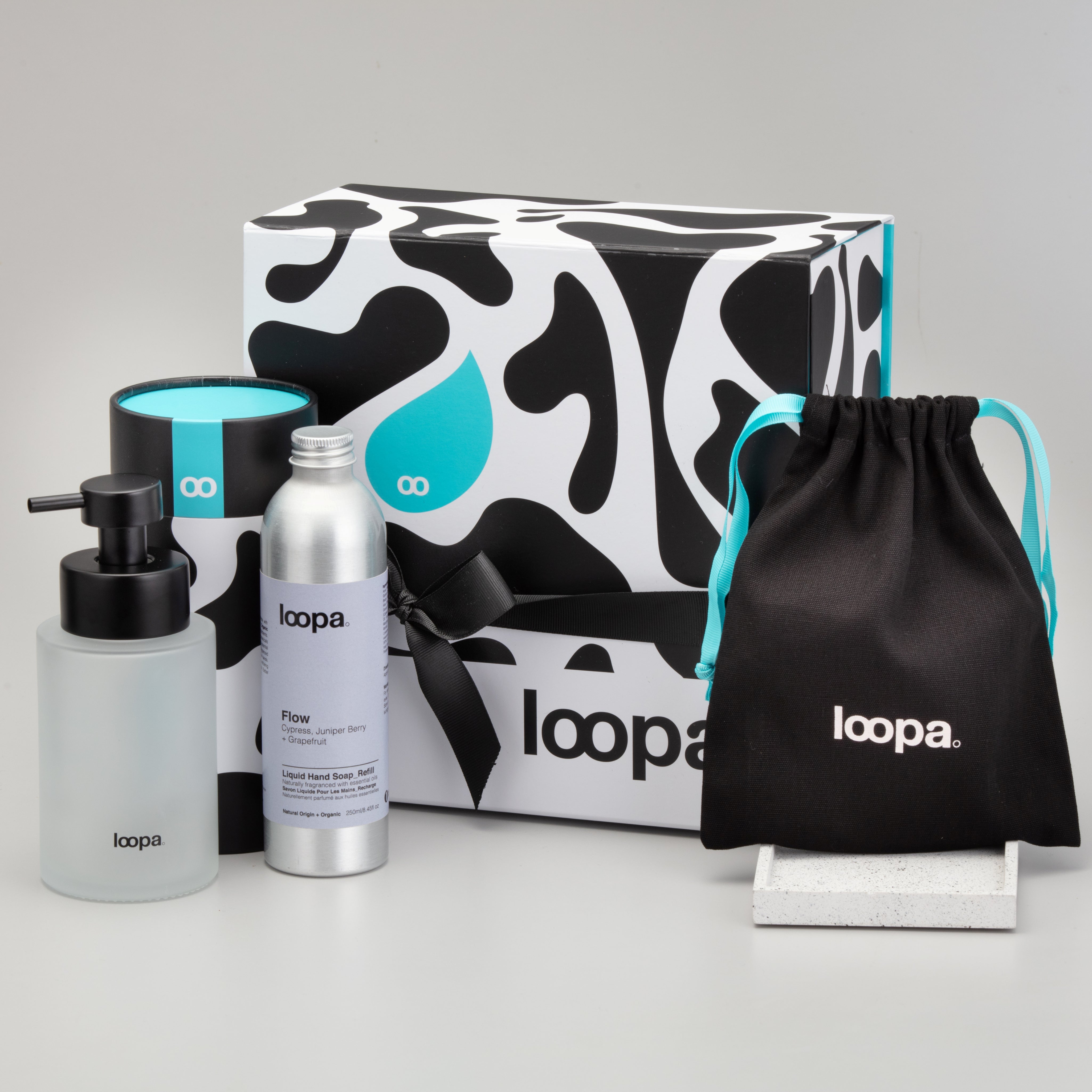 loopa product set including bottles and packaging on a gray background