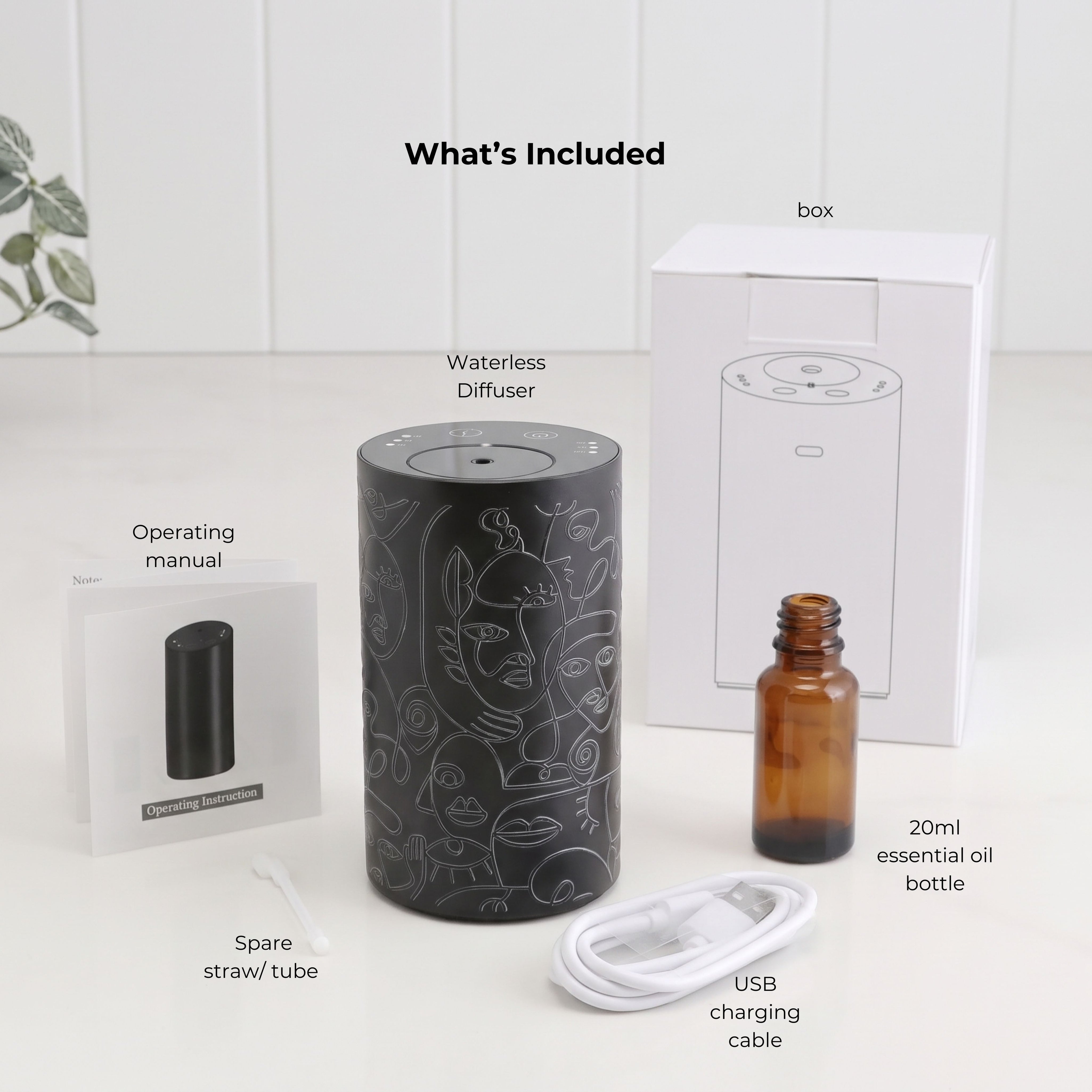 Loopa black cordless waterless essential oil diffuser with abstract line art design, displayed alongside its included accessories. Package contents show the rechargeable metal diffuser, 20ml amber glass essential oil bottle, USB charging cable, spare straw tube, operating instruction manual and white packaging box. Complete aromatherapy diffuser set for home fragrance.