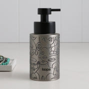 Brushed stainless steel round bottle dispenser with a black wrap label, presented as a 250ml refillable bottle for refined everyday use around the home