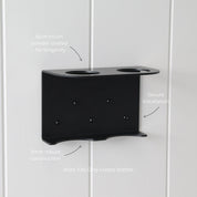 Loopa double wall-mounted soap dispenser holder made from durable 3mm aluminium with a protective black powder-coated finish. Featuring two circular bottle openings, a sturdy supporting base and secure wall fixings, this bracket provides an organised storage solution for bathrooms and showers. Designed exclusively for Loopa refillable 250ml and 500ml dispenser bottles.