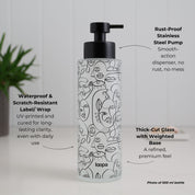 Frosted glass bottle dispenser featuring a black wrap with arrow detailing, designed for refillable soap or lotion use in refined home spaces