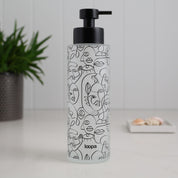 Frosted glass bottle dispenser with a black wrap label, presented as a refillable option for contemporary kitchens or bathrooms