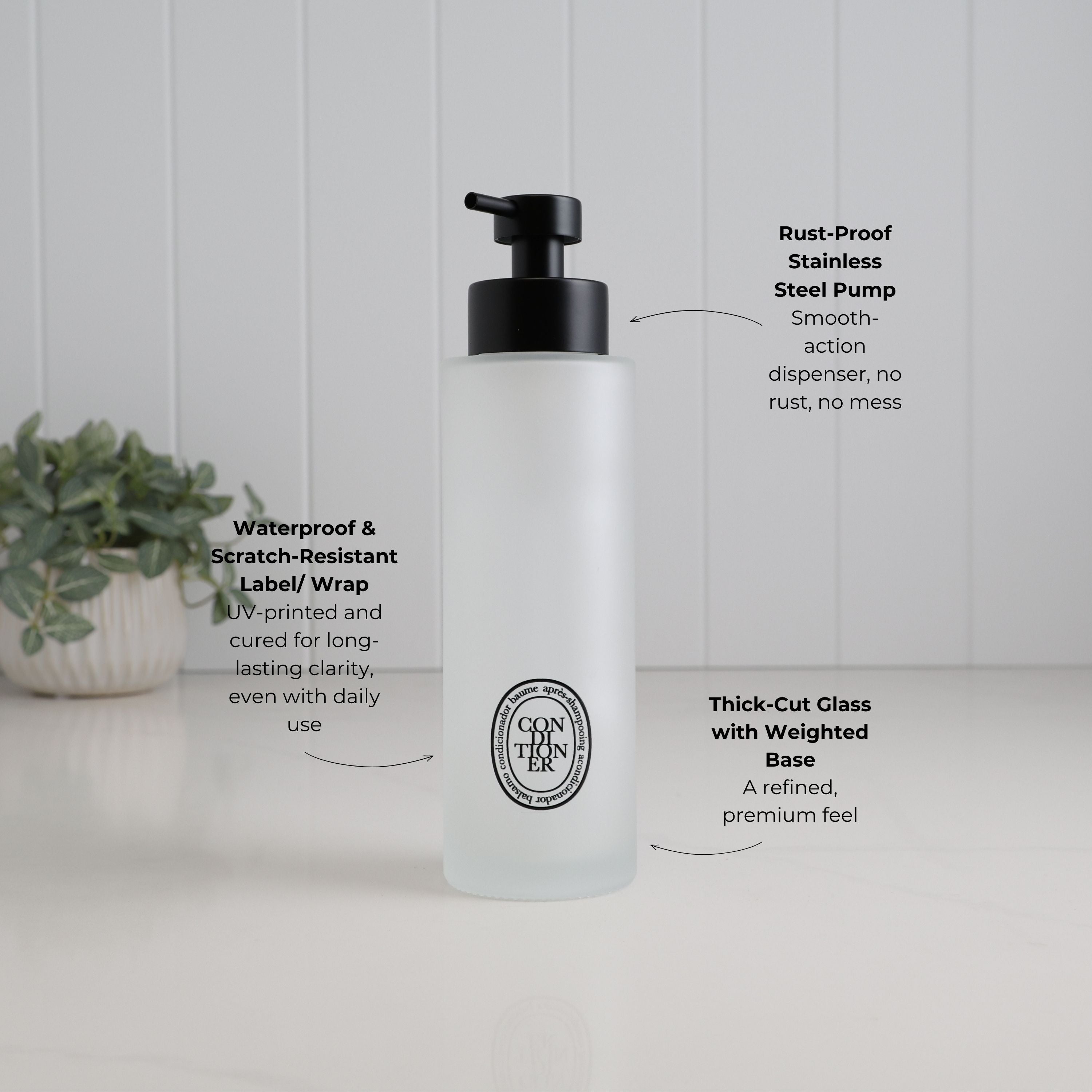 500ml frosted glass conditioner dispenser with black oval label and satin black stainless steel pump, highlighting thick-cut weighted glass and a waterproof, scratch-resistant UV-DTF label.