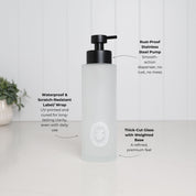 500ml frosted glass conditioner dispenser with white oval label, satin black stainless steel pump, weighted glass base and waterproof scratch-resistant UV-DTF label.