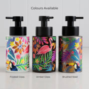 Three glass round bottle dispensers with tropical flamingo wrap designs in mixed colours, shown together as 250ml refillable options for soap or lotion